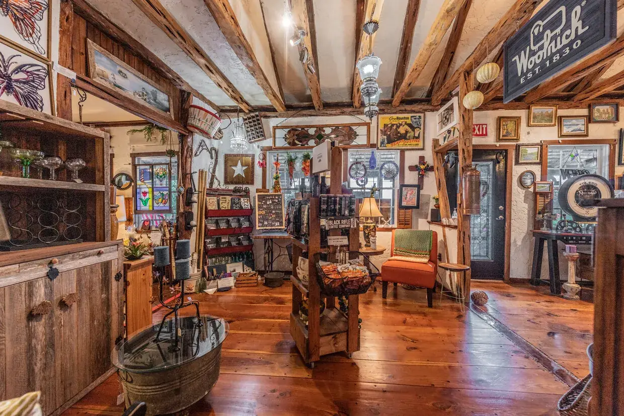 Antique retail interior with exposed timber beams and curated goods